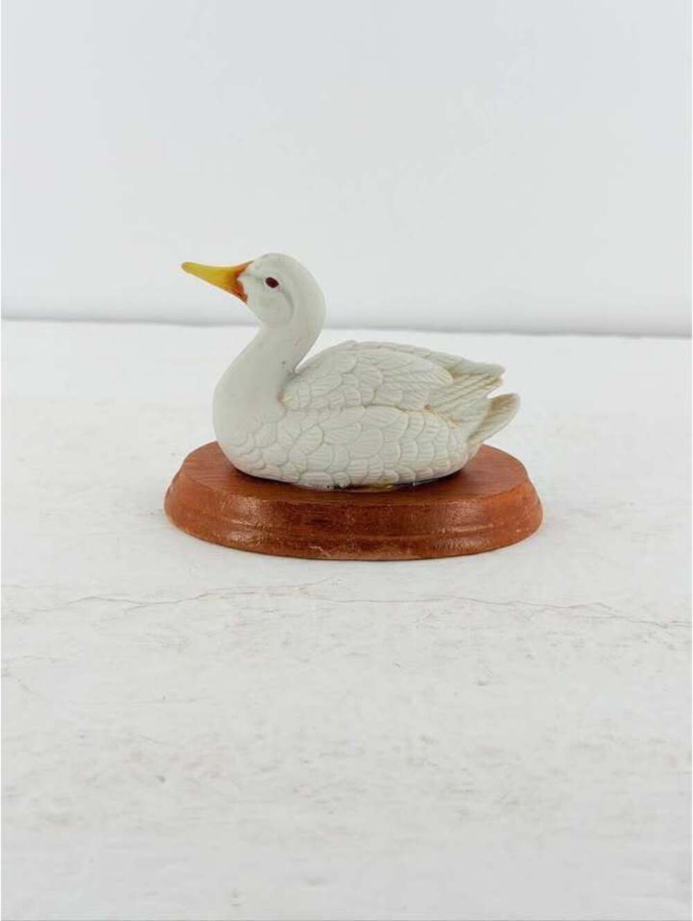 Porcelain Duck Figurine on Wood Base